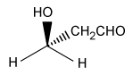 Passage Solid-phase peptide synthesis is normally carried out on a resin bathed multiple times in dimethylformamide (DMF) -a toxic, polar, aprotic solvent-which poses an environmental problem because a large amount of toxic solvent waste is created. Cyclic carbonates such as propylene carbonate (PC) and ethylene carbonate (EC) are nontoxic, polar, aprotic solvents that could be used as an alternative to DMF.Compounds <strong>1</strong> and <strong>2</strong> are modified L-amino acids. They were coupled to form Compound <strong>3</strong>, a dipeptide, which was then deprotected to yield Compound <strong>4</strong> (Figure 1) . <strong>Figure 1</strong> Synthesis of Compound <strong>4</strong>To determine the effect that solvent type and temperature have on the synthesis of this peptide, the nontoxic solvents PC and EC as well as the toxic solvent DMF were each used in separate syntheses of Compound <strong>4</strong> at different temperatures. The reaction solvent was also used to rinse the resin. Table 1 shows the results of these syntheses.<strong>Table 1</strong> Results from the Synthesis of Compound <strong>4</strong> The successful synthesis of Compound <strong>4</strong> using nontoxic solvents encouraged researchers to pursue the synthesis of a larger, biologically active peptide. Bradykinin, a vasodilator containing nine amino acids (Arg-Pro-Pro-Gly-Phe-Ser-Pro-Phe-Arg) , was synthesized using the same solid-state peptide synthesis protocol used to synthesize Compound <strong>4</strong>. Separate syntheses were done using either DMF or PC, and the purity of bradykinin from each synthesis was analyzed by high-performance liquid chromatography (HPLC) (Figure 2) .In each chromatogram, peak 1 has the same retention time as commercially obtained bradykinin, and the other peaks correspond to impurities. In chromatogram A, the impurity has a similar retention time to the product peak whereas the impurity peaks in chromatogram B have distinct retention times compared to the product peak. <strong>Figure 2</strong> HPLC of synthetic bradykinin: (A) synthesis in DMF; (B) synthesis in PC Adapted from S. B. Lawrenson et al., The greening of peptide synthesis. Green Chem. ©2017 The Royal Society of Chemistry. -The L designation of the amino acids used in peptide synthesis is based on the absolute configuration of L-glyceraldehyde. What is the structure of L-glyceraldehyde? A) B) C) D)