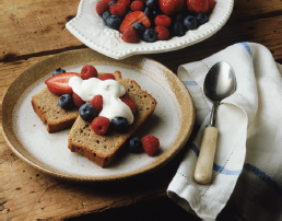 Estimate Your Fiber Intake  Review the sample menus shown in Table 4-7. The first menu contains 1600 kcal and 25 grams of fiber (AI for women); the second menu contains 2100 kcal and 38 grams of fiber (AI for men). Adapted from Fiber: Strands of protection. Consumer Reports on Health, p. 1, August 1999. How does your total fiber intake for yesterday compare with the general recommendation of 25 to 38 g of fiber per day for women and men, respectively? If you are not meeting your needs, how could you do so?    ? This dessert is an excellent source of fiber from 2 slices of whole-wheat banana bread (7 grams) with ½ cup of berries (1.8 grams) and 2 ounces of yogurt for a total of 8.8 grams of fiber.