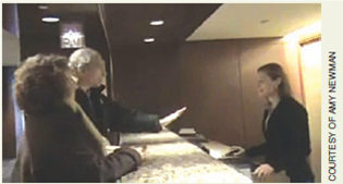 Write an email to a customer who posted negative feedback. Imagine that you work for the Colonnade Hotel and Resort, and a customer posted a video of his negative experience checking into the hotel (Figure). The customer also posted a negative review of the hotel on a travel website (Figure).     Prepare an email to the customer, addressing his concerns. How can you win over this very angry customer?<div style=padding-top: 35px> 