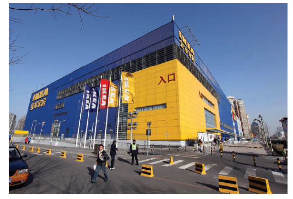 IKEA IKEA has been called one of the most extraordinary success stories in the history of postwar European business. However, the first few years of the twenty-first century were difficult for IKEA, the $31 billion global furniture powerhouse based in Sweden. The euro's strength dampened financial results, as did an economic downturn in Central Europe. The company faces increasing competition from hypermarkets, do-it-yourself retailers such as Walmart, and supermarkets that are expanding into home furnishings. During his tenure as CEO from 1999 to 2009, Anders Dahlvig stressed three areas for improvement: product assortment, customer service, and product availability. With stores in 40 countries, the company's success reflects founder Ingvar Kamprad's social ambition of selling a wide range of stylish, functional home furnishings at prices so low that the majority of people could afford to buy them. The store exteriors are painted bright blue and yellow, Sweden's national colors. Shoppers view furniture on the main floor in scores of realistic-looking settings arranged throughout the cavernous showrooms. At IKEA, shopping is a self-service activity; after browsing and writing down the names of desired items, shoppers can pick up their furniture on the lower level. There, they find flat packs containing the furniture in kit form; one of the cornerstones of IKEA's low-cost strategy is having customers take their purchases home in their own vehicles and assemble the furniture themselves. The lower level of a typical IKEA store also contains a restaurant, a grocery store called the Swede Shop, a supervised play area for children, and a baby care room. IKEA's unconventional approach to the furniture business has enabled it to rack up impressive growth in an industry in which overall sales have been flat. Sourcing furniture from a network of more than 1,600 suppliers in 55 countries helps the company maintain its low-cost, high-quality position. During the 1990s, IKEA expanded into Central and Eastern Europe. Because consumers in those regions have relatively little purchasing power, the stores offer a smaller selection of goods; some furniture is designed specifically for the cramped living styles typical in former Soviet bloc countries.   Exhibit 16-11 IKEA currently has eleven stores in China; the Xu Hui store in Shanghai is one of the Swedish company's top performers by revenues. In keeping with IKEA's standardized global retail concept, the Chinese stores are spacious and clean. All locations feature restaurants where visitors can enjoy Swedish meatballs and other meal items. In some cases, the restaurants have also become a favorite meeting place for dating clubs that allow older Chinese to socialize. Source: Doug Kanter/Bloomberg via Getty Images. Throughout Europe, IKEA benefits from the perception that Sweden is a source of high-quality products and efficient service. Currently, Germany and the United Kingdom (UK) are IKEA's top two markets. The United Kingdom represents IKEA's fastest-growing market in Europe. Although Britons initially viewed the company's less-is-more approach as cold and too Scandinavian, they were eventually won over. IKEA currently has 18 stores in the UK, and plans call for opening more in this decade. As Allan Young, creative director of London's St. Luke's advertising agency, noted, IKEA is anticonven- tional. It does what it shouldn't do. That's the overall theme for all IKEA ads: liberation from tradition. In 2005, IKEA opened two stores near Tokyo; more stores are on the way as the company expands in Asia. IKEA's first attempt to develop the Japanese market in the mid-1970s resulted in failure. Why? As Tommy Kullberg, former chief executive of IKEA Japan, explained, In 1974, the Japanese market from a retail point of view was closed. Also, from the Japanese point of view, I do not think they were ready for IKEA, with our way of doing things, with flat packages and asking the consumers to put things together and so on. However, demographic and economic trends are much different today. After years of recession, consumers are seeking alternatives to paying high prices for quality goods. Also, IKEA's core customer segment-post-baby boomers in their thirties-grew nearly 10 percent between 2000 and 2010. In Japan, IKEA will offer home delivery and an assembly service option. The coming years will bring big changes at IKEA. In 2013, Peter Agnefjall became the company's new chief executive. He plans to continue the company's sustainability initiatives, including the possibility of leasing kitchens to consumers. As Steve Howard, chief sustainability officer, said, We want a smarter consumption, and maybe people are less attached to ownership. However, some observers question IKEA's sustainability bona fides, noting that its low-priced furniture contributes to a throw it away mentality when a piece breaks. Howard responds to such criticism by noting that People have needs to be met-they need wardrobes, sofas, kitchens. The most important thing is to meet those needs in the most sustainable way possible. For example, in France, one factory sources half its wood from recycled IKEA products that are ground up and repurposed as bookshelves, tables, and other new products. At the end of Chapter 11, it was noted that managers of IKEA stores have a great deal of discretion when it comes to setting prices. In terms of the ethnocentric/polycentric/ regiocentric/geocentric (EPRG) framework, which management orientation is in evidence at IKEA?<div style=padding-top: 35px> 