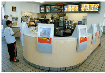 Just Swipe It  Ordering food has not changed for 30 to 40 years. Now, McDonald's is ready to change how you pay for your Happy Meal in Europe with touch screens and swipe cards. They will also be revamping their menu and introducing longer opening hours to make it easier for their customers and improve efficiency. McDonald's is also looking forward to harvesting more information about their customers' ordering habits. The people of the United Kingdom will shortly be able to swipe their Visa debit cards as simply as their Oyster cards. (The Oyster card is a form of electronic ticketing used on public transport services within the Greater London area of the United Kingdom.) They may also introduce roving waiters with handheld terminals to assist customers with extra products such as ice cream cones without them having to return to the till. This move has been triggered by the pervasive use of technology in Japan, whose citizens currently use their mobile phone for tickets.     On the bright side, (1) you will not have to repeat your order several times, (2) you can get a McDonald's meal without having cash in your wallet, and (3) the ordering process will speed up, thereby reducing the lines. On the not-so-bright side, (1) expect thousands to lose their jobs, and (2) McDonald's may act like Google and log, monitor, and do analytics of your buying behavior. At a time when many retail and consumer companies are racking up sluggish or even shrinking sales in Europe, McDonald's like-for-like sales rose 5.7 percent year-on-year in the first quarter and McDonald's North American sales were up 2.9 percent in 2011-the highest growth out of its three main geographic regions. McDonald's reduced the locations in Europe, but the U.S. company is looking for 50,000 new employees. McDonald's new system could face criticism in a sensitive time just months from a global recession when people are still struggling to find jobs. Why?