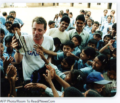 LEARN FROM ROLE MODELS His life changed and its second chapter started after a trekking holiday in Nepal.  Former Microsoft Executive Fights Illiteracy and Gains Fulfillment      T here are many ways to help build a better society. John Wood's choice is social entrepreneurship that promotes literacy for children in the developing world. During a successful career as a Microsoft executive, his life changed after he went on a trekking vacation to the Himalayas of Nepal. While there, Wood was shocked at the lack of schools and limited access to educational materials. He pledged to collect books for a Nepalese school that he visited on his trip, and he returned a year later with 3,000 to give to the students. But the impact on his future didn't end there. Wood was inspired to leverage his years of executive experience to accomplish more through nonprofit work. Wood quit his Microsoft job to found Room to Read. It builds libraries and schools in poor nations like Nepal, Cambodia, Vietnam, and Laos, and publishes local language books to help fill them. Now in what he calls the second chapter in his life, Wood's passion is to provide the lifelong benefits of education to poor children. His organization's website describes the vision this way: We envision a world in which all children can pursue a quality education that enables them to reach their full potential and contribute to their community and the world. Picture this scene in Laos, one of the world's poorest nations. Children sit happily in a small library filled with books reading a story with their teacher. It's a Room to Read project. So far the organization has put in place over 700 libraries and built 140 schools in this small land-locked Southeast Asian country. Laos has just over 8,000 primary schools nationwide and the majority offer only incomplete educational experiences. The Room to Read model is so efficient that it can build schools for as little as $6,000 and is now setting up five or six new libraries each day. Over 10,000 libraries are already in place in Asia and Sub-Saharan Africa. Time magazine called Wood and his team Asian Heroes. Fast Company magazine gave Room to Read its Social Capitalist Award. Noting that one-seventh of the global population can't read or write, Wood says: I don't see how we are going to solve the world's problems without literacy. FIND THE INSPIRATION Room to Read builds one school or library at a time, but the results add up quickly-almost 10 million children have benefited from Room to Read's programs to date. Is the success of Room to Read due in part to Wood's prior business and management experience How can such experience help nonprofit organizations Can you identify a social problem in your community that might be addressed using John Wood and his work with Room to Read as a role model How do you see yourself fulfilling higher order needs in the future Will earning good money at work be enough, or will your self-actualization require something more