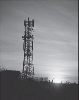 Multigenerational Effects of Ozone Depletion and Greenhouse Gases 12  The long-term effects of ozone depletion from hydrochlorofluorocarbon (HCFC) emissions and of CO₂ and other greenhouse gases from the burning of fossil fuels are controversial. Environmental scientists insist that the release of HCFCs opened a gaping hole in the ozone shield that provides protection from the sun's ultraviolet (UV) rays. More recently, some scientists have argued that the increasing concentration of greenhouse gases has raised global temperatures. What is less controversial is that these environmental events have massive consequences for human health and wealth. Increasing incidence of skin cancers, melting polar icecaps, and rising sea levels imply tangible losses of catastrophic proportions-perhaps many billions of dollars annually. Some of these losses are immediate, but others are perhaps 100 years off. Benefit-cost analysis normally considers projects no more than 20 to 30 years long and employs discount rates of 2 to 8 percent. How should one discount such an uncertain and distant future as is involved in ozone depletion and greenhouse gases Assuming a constant discount rate equal to the rate of return on long-term government bonds (5.43 percent), the discount factor that should be applied to find the present value of projected benefits or losses avoided in year 100 would be (1/1.057 100 ) = 0.003913 or $3,913,780 present value per billion dollars of future losses avoided in year 100. Notice what happens, however, if uncertainty about the appropriate discount rate varies from 2 to 8 percent. The discount factor at 100 years would then vary from (1/1.02 100 ) = 0.13803 or $138,032,967 per billion dollars for 2 percent, to as little as (1/1.08 100 ) = 0.000454, or $454,595 per billion dollars for 8 percent. The possibility of lower discount rates implies that more than $138 million dollars should be spent today to avoid the projected $1 billion in delayed damage 100 years from now! Of course, the higher 8 percent rate implies spending less than one-half a million to avoid the $100 billion future loss. This range of present value estimates from $138 million to $454,595 is beyond what any analyst can work with in doing sensitivity analysis. What should a benefit-cost analyst conclude And what should businesses whose cash flows depend on fun in the sun recreation like golf courses and theme parks and beachside hotels or physical assets built near sea level like the New York and Shanghai business districts conclude about the justifiable capital expenditure to slow down or reverse global warming  One insight is that it is not the 5 percent average discount rate between 2 and 8 percent that matters in such circumstances, just as the average depth of a pool does not determine the hazard to someone who cannot swim. Instead, the lowest applicable discount rate largely determines the present value of very distant cash flows because higher-discount-rate scenarios like 7 and 8 percent inevitably sum to essentially zero at 100 years. Martin Weitzman has calculated what discount rate is implied by assuming the discount rate begins at 4 percent and then follows a random path with equiprobable higher and lower rates and a standard deviation of 3 percent. The results led him to recommend a sliding-scale discount rate of 2 percent for 25- to 75-year and 1 percent for 76- to 300-year cash flows. The fact that lower discount rates have such dramatically nonsymmetrical effects on present value when very distant benefits are involved means that the present value of reducing CO₂ emissions and other greenhouse gases may be much higher than previously thought. As decision makers worldwide consider the options for reducing greenhouse gases (CO₂ , methane, nitrous oxide, etc.), one glaring fact surfaces quickly. The U.S. Energy Information Administration estimates that 41 percent of all the CO₂ emissions we generate in the United States come from electricity generation, and 83 percent of that comes from burning coal (see Figure). So, 34 percent (0.41 × 0.83) of all U.S. CO₂ emissions comes from coal-fired power plants. Not surprisingly, much interest in preventing global warming has therefore centered on alternative sources of electrical energy generation. The popular inequality RE  FIGURE Greenhouse Gas Emissions in the United States     What exactly are the alternative sources of electrical energy Wind power, solar power, biomass, hydro, biofuel, geothermal, and ocean tidal power all contain some attractive common features for the United States. They are renewable resources in abundant local supply with low carbon footprints. At present, only 5 percent of electrical generation comes from all these alternative energy sources rather than coal (83 percent), natural gas (15 percent), or negligible fuel oil (again see Figure 17.3). Natural gas is now much cheaper today than coal per British thermal unit (BTU), but its carbon footprint (though 80 percent cleaner than coal) is still quite substantial. Rather than spending almost $1 billion a day in net wealth transfer for foreign crude oil, Americans now perceive that natural gas is their most plentiful energy resource. Indeed, at present rates of consumption, the United States has more proven reserves of coal (100 years) and natural gas (110 years' worth) than Saudi Arabia has proven reserves of oil (85 years).     But 1 ton of coal generates a megawatt of electricity plus 1 ton of CO₂ byproduct. The marginal cost for delivered coal has varied from $45 to $82 per ton in 2007-2012, and the electricity is worth from $0.06/kWh in Washington state to $0.12/kWh in New York state. Taking the 2013 cost of coal ($88) and the weighted average value of electricity across the United States ($0.11), the electrical generation industry pays $80 per ton for coal on the spot market and produces a $110 megawatt of electricity. The problem is that when one includes the market cost of a ton of CO₂ byproduct, using the 2013 price of the CO₂ emission trading contract in the European Union (EU) of $10, 13 a typical public utility in the United States must recover all its capital cost from the remaining tiny $12 operating profit ($110 - $88 - $10 = $12) per megawatt hour. Even a giant 500-megawatt U.S. power plant would therefore project (under a capand- trade carbon emissions trading regime) net cash flow of only $6,000 per hour for perhaps 20 hours a day or $120,000 per day to recover capital equipment costs and earn a profit. That sums to $42 million per year, sufficient at a 5% CoC to generate only $840 million present value of the net cash flow against the $900 million net investment of a 500-megawatt coal-fired power plant plus smokestack scrubbers, even if the cash flows last 50 years. The way forward is natural gas (NG) production, which has exploded in the United States, resulting in an 84 percent reduction in its equilibrium price, now half the cost of coal per BTU. At a 7 percent discount rate, what annual cash flow is needed to make the 500-megawatt plant profitable What about using NG at half the cost of coal