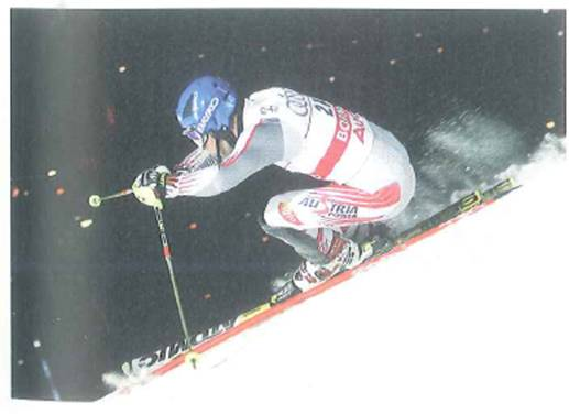 Suppose the slope conditions for the skier shown in Fig. are such that the skier travels at a constant velocity. From the photo, could you find the coefficient of kinetic friction between the snowy surface and the skis If so, describe how this would be done.     FIGURE A down slope run See Exercise.