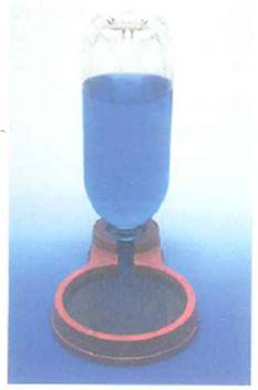 A water dispenser for pets contains an inverted plastic bottle, as shown in Fig. (The water is dyed blue for contrast.) When a certain amount of water is drunk from the bowl, more water flows automatically from the bottle into the bowl. The bowl never overflows. Explain the operation of the dispenser. Does the height of the water in the bottle depend on the surface area of the water in the bowl      FIGURE Pet barometer See Conceptual Question.