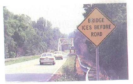 Why is the warning shown on the highway road sign in Fig. necessary FIGURE A cold warning See Conceptual Question.
