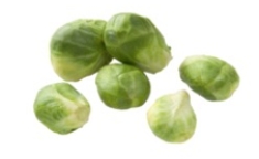 Identify the vegetable shown in the picture.   A)  Chayote B)  Fiddlehead ferns C)  Shallots D)  Brussel sprouts