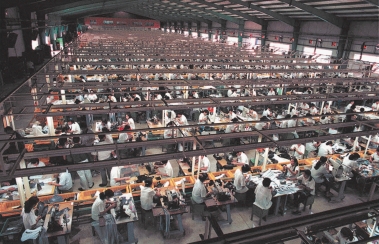   -The accompanying photo shows a Chinese workforce eager to work for low wages. This is an example of ____. A)  offshoring B)  outshoring C)  offsourcing D)  insourcing