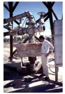 The photograph shown below is that of a water well casing in California. When groundwater was withdrawn, the ground surface dropped, leaving part of the well exposed above ground.    -What likely happened to the permeability of the aquifer when this occurred? A)  Permeability probably decreased to compaction. B)  Permeability probably increased due to compaction. C)  Permeability probably did not change.