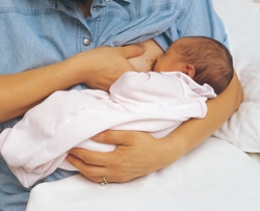 The nurse is teaching a postpartum client different holds for breastfeeding. Which of the following figures depicts the football hold frequently used for clients who have had a cesarean birth? A)    B)    C)    D)   