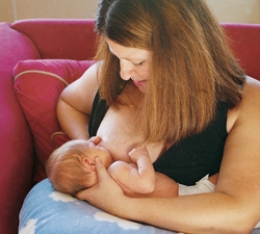 The nurse is teaching a postpartum client different holds for breastfeeding. Which of the following figures depicts the football hold frequently used for clients who have had a cesarean birth? A)    B)    C)    D)   