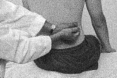 Which assessment technique is the nurse performing in the figure below?   A)  Direct percussion B)  Indirect percussion C)  Light palpation D)  Deep palpation