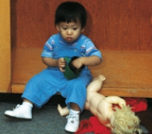 A nurse is admitting a toddler to the hospital. The parent needs to leave for a brief period. Which figure depicts the reaction the nurse expects from the child? A)    B)    C)    D)   