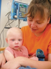 A nurse is admitting a toddler to the hospital. The parent needs to leave for a brief period. Which figure depicts the reaction the nurse expects from the child? A)    B)    C)    D)   