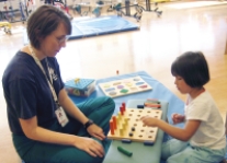 A nurse is admitting a toddler to the hospital. The parent needs to leave for a brief period. Which figure depicts the reaction the nurse expects from the child? A)    B)    C)    D)   