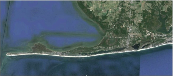 What direction is the longshore current in the area pictured below?   A)  right to left B)  top to bottom C)  left to right D)  impossible to tell from this figure 