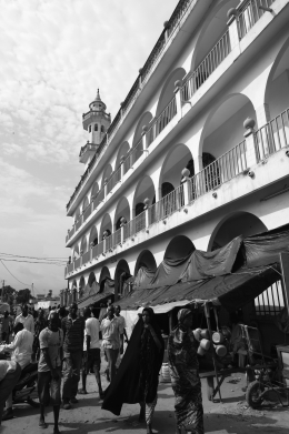 <strong>What does anthropologist Bruce Whitehouse's research with Malian migrants to Brazzaville in the Republic of Congo suggest? </strong> A) They are mostly Christian. B) They work mostly in factories. C) They are treated like outsiders, segregated by religion and language. D) They rarely return to their home community of Togotala.