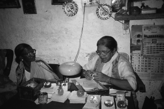 The text discusses a tiny courtyard in India where a Muslim healer named Amma meets dozens of patients daily. Amma's healing room crosses seemingly rigid gender boundaries, since she is a female healer in a position of spiritual leadership. What other seemingly rigid boundaries does Amma's healing room cross?   A)  ethnic boundaries, since Amma is biracial B)  boundaries between science and religion, since Amara uses medicine to heal C)  age boundaries, since Amma was one of the youngest healers in India D)  religious boundaries, since followers of many religions come to see Amma