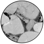 What is the purpose of the cement surrounding the grains in the photo?   A) It creates a coherent,intact rock. B) It allows water to move through the rock. C) It holds the grains together during deposition. D) It provides a way to transfer chemicals between minerals.