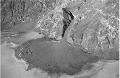 The figure below shows a road in Death Valley,California,curving around a(n) ________.   A) natural levee B) river delta C) alluvial fan D) braided stream