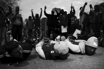 Many activists argue that  stop and frisk  policing tactics disproportionately profile men of color because over 80 percent of those stopped are African American and Latino. According to these activists, this practice is an example of:   A)  interpersonal racism. B)  institutional racism. C)  racialization. D)  ethnicity.