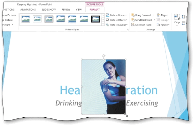   -When you insert a clip on a slide without a clip content placeholder,the clip is inserted ________________________ of the slide,as shown in the accompanying figure.