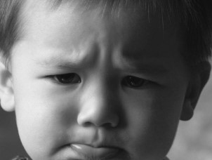 The child shown in the figure below is not feeling well.Why does the poster say  No Antibiotics Please ?   A)  His illness may be caused by an allergy to penicillin. B)  Antibiotics should be taken only to promote growth. C)  His illness is caused by bacteria. D)  His illness is caused by a virus.