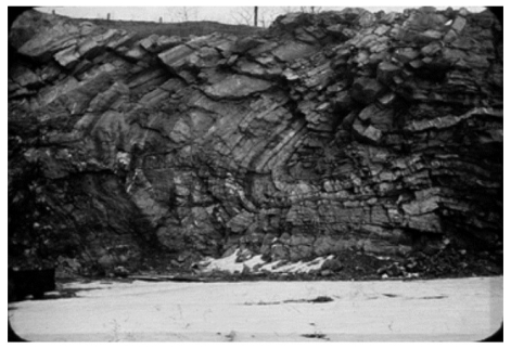 What kind of geologic structure is present in the photograph below? a)______________________________ Explain your answer. b)______________________________   
