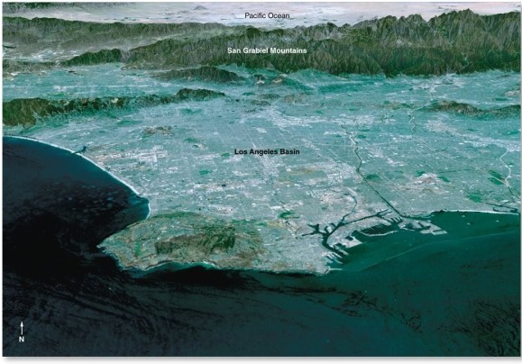 Which of the following is not a contributing factor to the poor air quality in Los Angeles?   A) the city lies in a basin surrounded by mountains B) frequent subsidence inversions C) typically cloud-free conditions during afternoon D) heavy rainfall