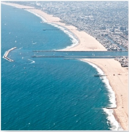   Which are these features that block material from entering a harbour? A) Breakwaters. B) Groins. C) Jetties. D) Tombolos.
