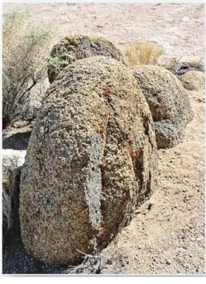   These rounded granite outcrops are the result of which weathering process? A) Oxidation. B) Hydration. C) Spheroidal weathering. D) Carbonation.