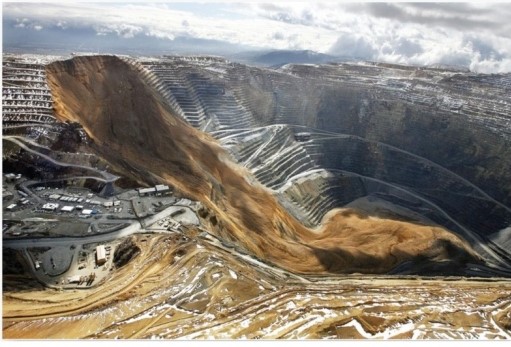   The photograph shows an example of which mass movement processes? A) Debris flow and scarification. B) Scarification and mudflow. C) Landslide and earthflow. D) Scarification and landslide.