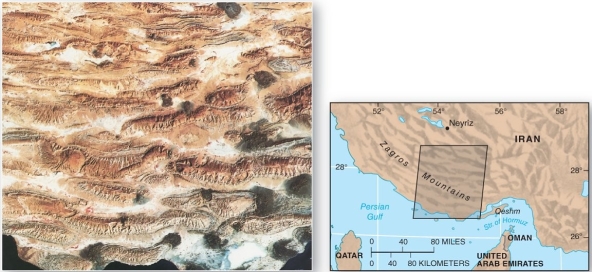   The Zagros mountains of Iran is an example of A)  a series of faulted mountain blocks. B)  a zone of tension. C)  a zone of shearing motions. D)  a zone of compression and folding.