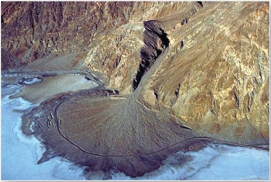   This landform results from when water exists a constricted channel and loses velocity. A)  meander scar B)  delta C)  alluvial terrace D)  alluvial fan
