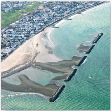   These features create zones of still water near coastlines. A)  breakwaters B)  groins C)  jetties D)  tombolos