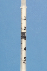 Identify the dosage measured on the syringe.  