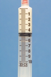 Identify the dosage measured on the syringe.  