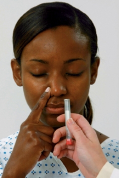 The client in the photograph is having a cranial nerve assessment. Which cranial nerve is the nurse assessing?   A)  Olfactory nerve (cranial nerve I) . B)  Optic nerve (cranial nerve II) . C)  Oculomotor nerve (cranial nerve III) . D)  Trochlear nerve (cranial nerve IV) .