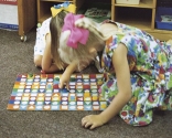 A nurse is observing children at play.Which figure depicts associative play? A)     B)     C)     D)    