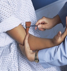 <strong>Which figure depicts a nurse performing a test for the triceps reflex?</strong> A) B) C) D)