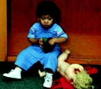 A nurse is admitting a toddler to the hospital.The parent needs to leave for a brief period.Which figure depicts the reaction the nurse expects from the child? A)     B)     C)     D)    