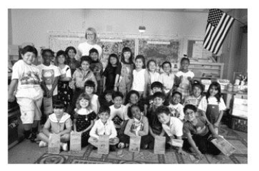 In a research study on false memories, psychologist Stephen Lindsay showed half the participants their actual first-gradeclass photo, like the one shown here, and asked them to read adescription of a prank that supposedly happened in firstgrade. What was the effect of looking at the photo?   A) The rate of false memories was same regardless of whether participants looked at their first-grade photo or not. B) Looking at the photo greatly reduced the likelihood of producing a false memory. C) Looking at the photo greatly increased the likelihood of producing a false memory. D) Participants who did not look at the photo were much more likely to produce false memories than those who looked at the photo.