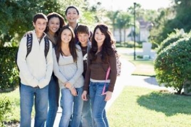 This photo shows adolescents who are wearing similar clothes and are behaving in a similar fashion. What is this tendency toadjust one's behavior or attitude to group norms called?   A) prosocial behavior B) conformity C) altruism D) ethnocentrism