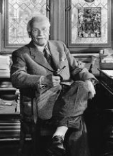 Who is shown in this photograph?   A) British psychologist Hans Eysenck, who developed the idea that personality consists of three basic traits B) American psychologist Carl Rogers, who developed the idea of  unconditional positive regard  C) Swiss psychiatrist Carl Jung, who developed the idea of the  collective unconscious  D) American psychologist Albert Bandura, who developed the social-cognitive perspective of personality and the idea of  reciprocal determinism 