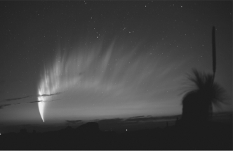 Identify the object in the picture below.   A)  an active comet B)  a meteor shower C)  a meteorite D)  an asteroid E)  zodiacal dust