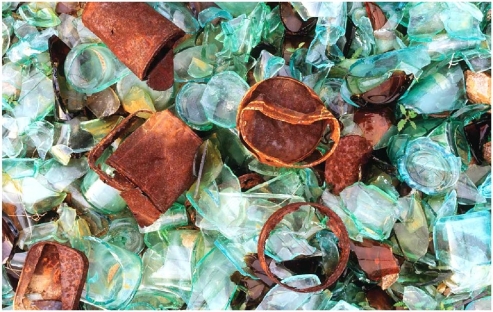    How are the two main categories of weathering represented in this image that shows human-made objects?