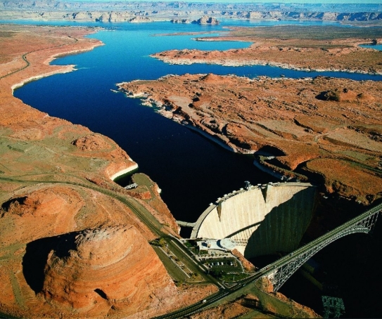    Examine the photo of Glen Canyon Dam in Arizona and the reservoir called  Lake Powell  that formed upstream of it. Describe what has happened to base level on the Colorado River at this location since the dam was constructed. Make a prediction for what will happen at this location over the next several hundred years.