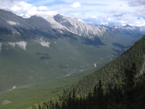   What formed this valley's distinctive  U  shape? A) river erosion B) wind erosion C) dune movement D) glacial erosion