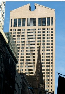 The building on the right within the figure     A) is more modernist, because of its squarish, rectilinear shape. B) is more post-modernist because of its odd angles and shapes. C) is more structuralist because the underlying steel cannot be seen. D) is more Marxist because this building led to worker revolt.