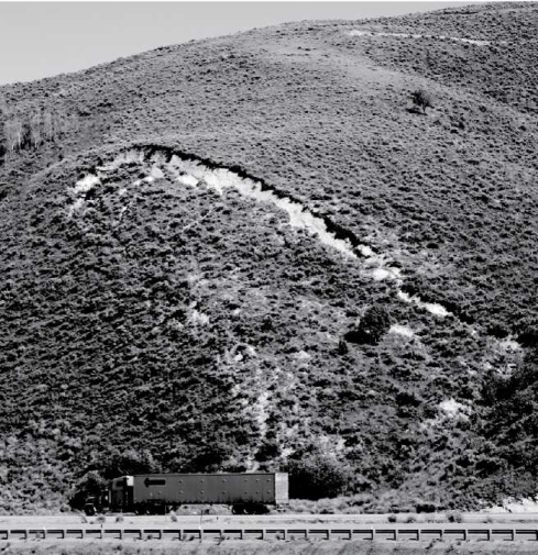 Examine the photograph below. What type of mass wasting event is beginning to take place here? How can you tell?   
